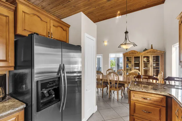 a kitchen with a refrigerator and a sink