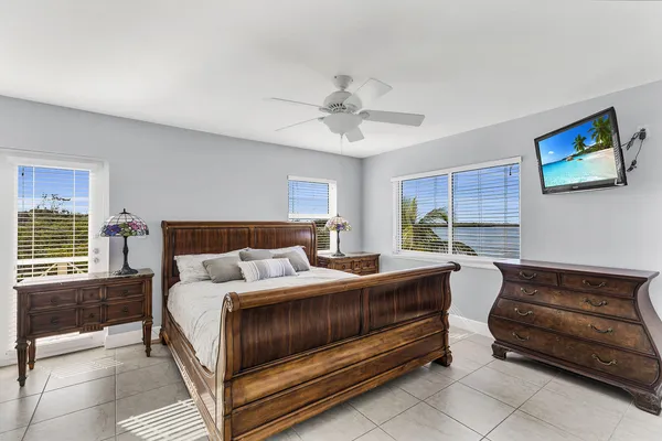 a bedroom with a bed and a couch