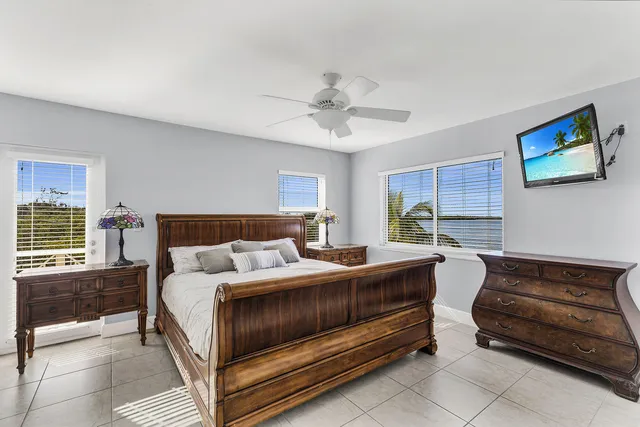 a bedroom with a bed and a couch