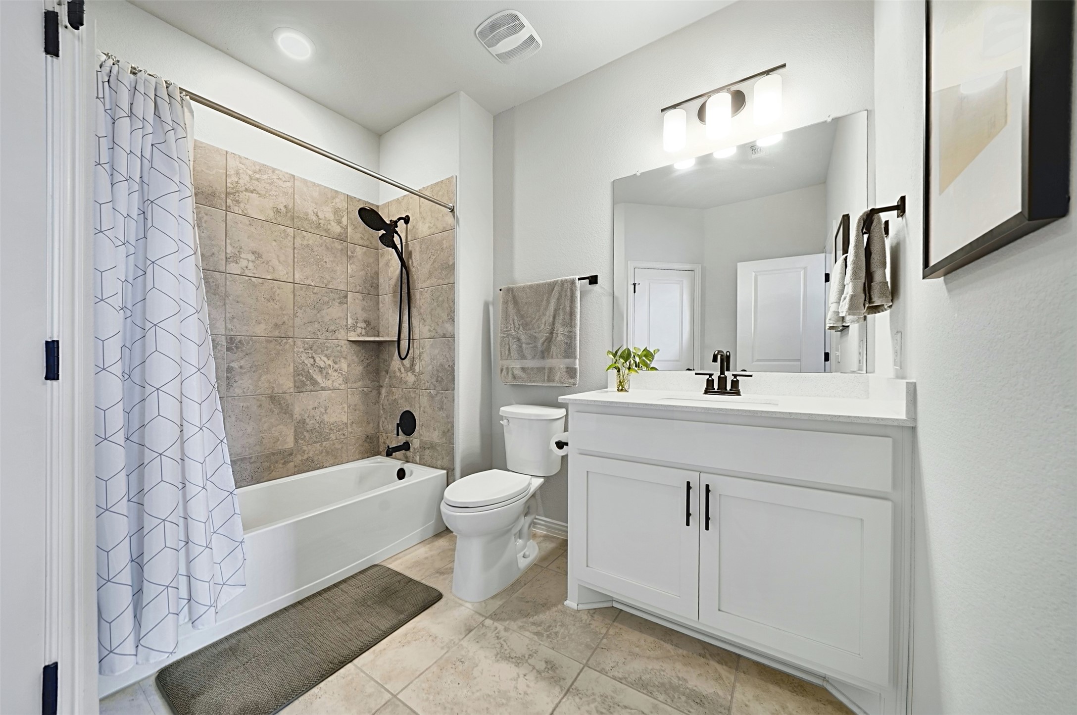 903 Simmental Loop Hutto, TX 78634 - Photo 21 of 26 Third full bathroom is attached to the office, making it ideal for a guest room.