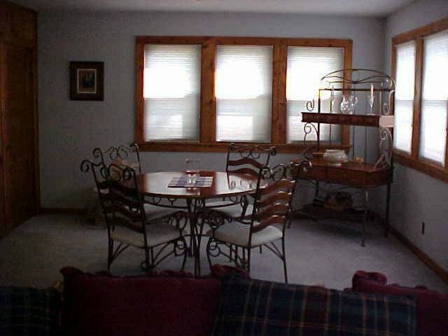6648 Riverview Road Thomson, IL 61285 - Photo 8 of 8 a view of a dining room with furniture and a window