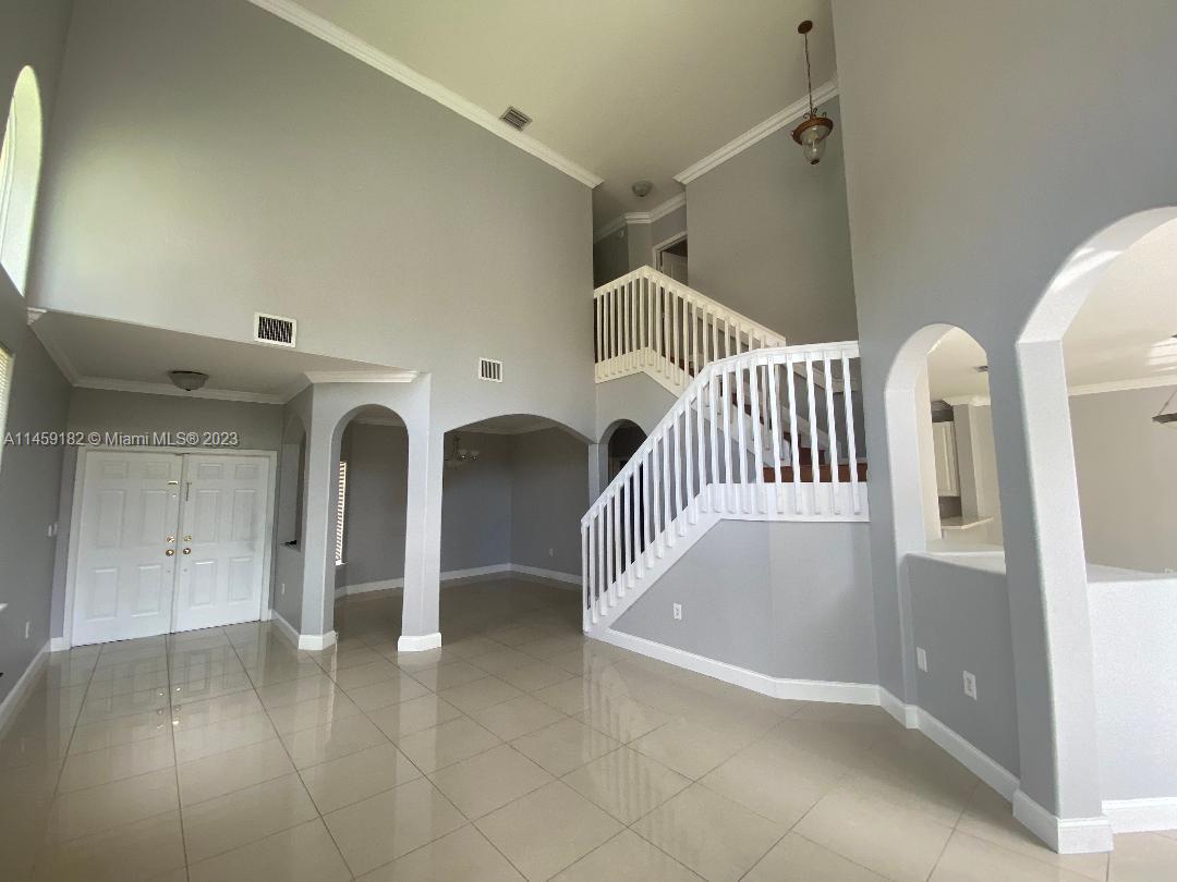 5586 Northwest 112th Path Doral, FL 33178 - Photo 13 of 30 a view of an entryway with a livingroom