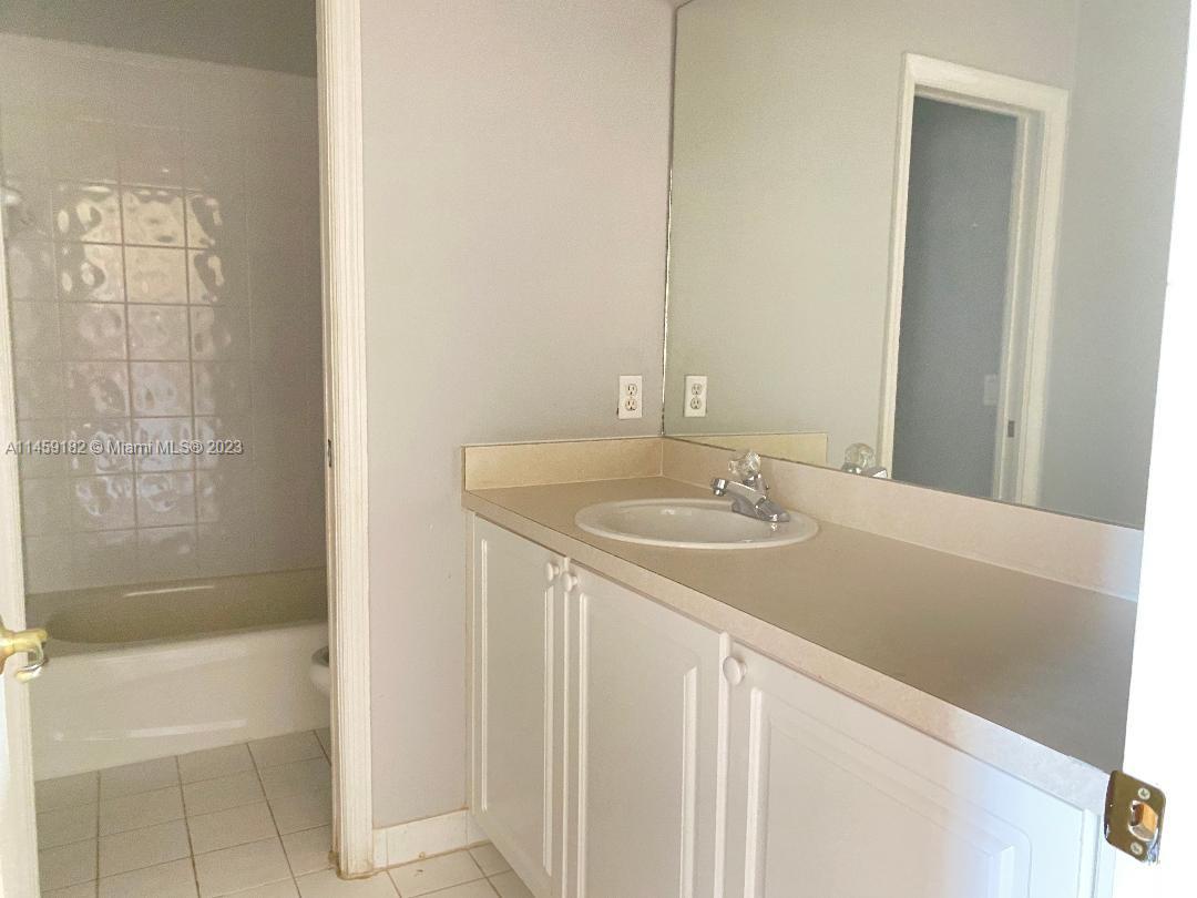 5586 Northwest 112th Path Doral, FL 33178 - Photo 19 of 30 a bathroom with a sink and a bathtub