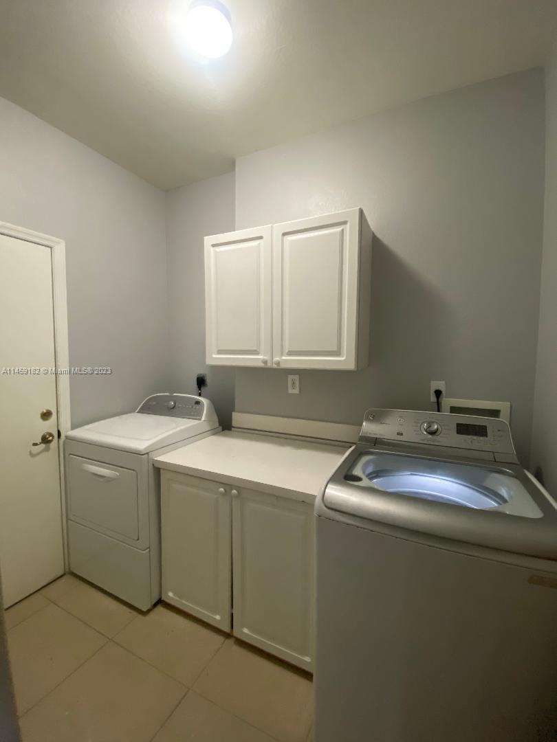 5586 Northwest 112th Path Doral, FL 33178 - Photo 22 of 30 a utility room with dryer and washer