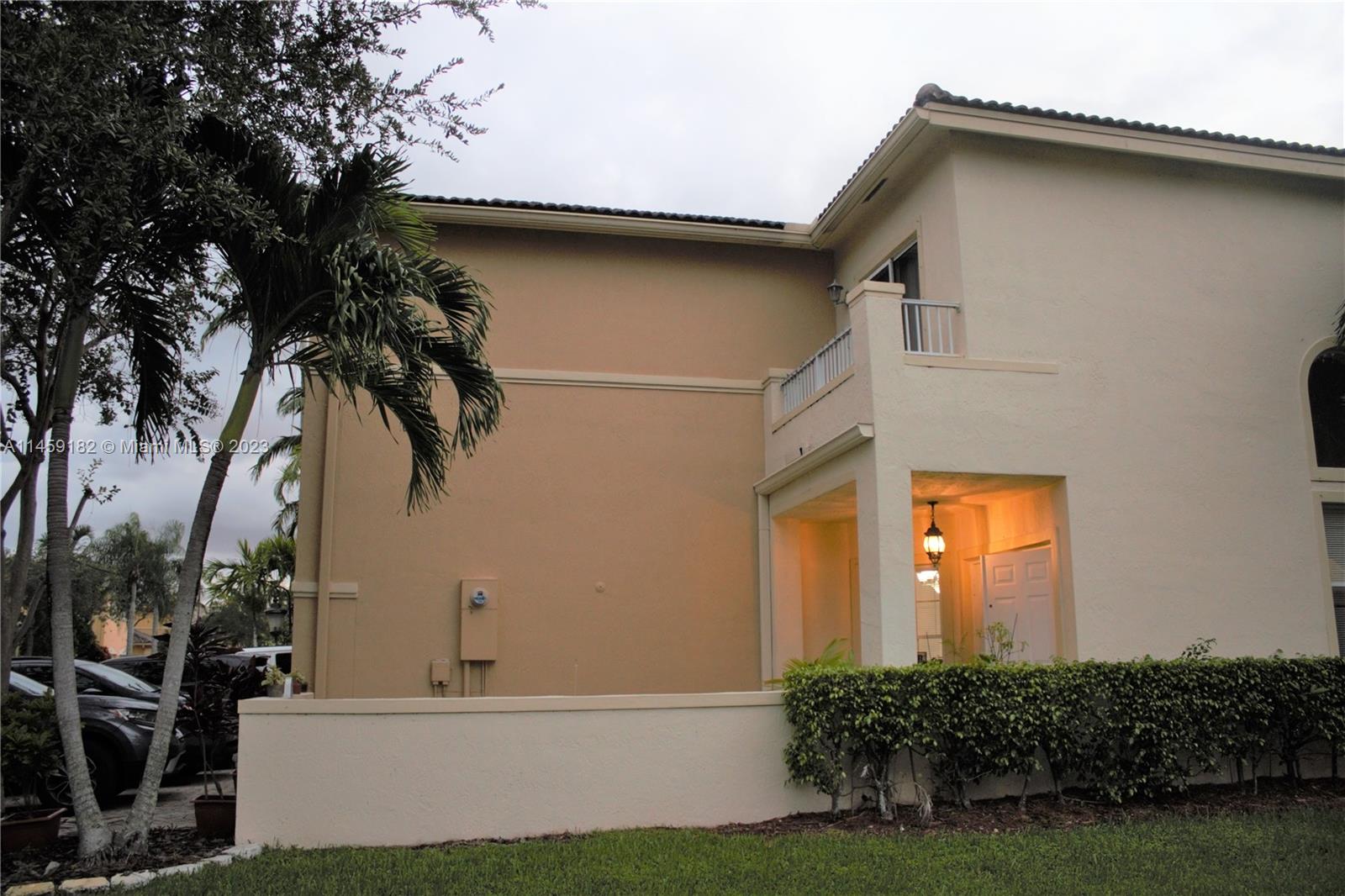 5586 Northwest 112th Path Doral, FL 33178 - Photo 29 of 30 a front view of a house with a yard