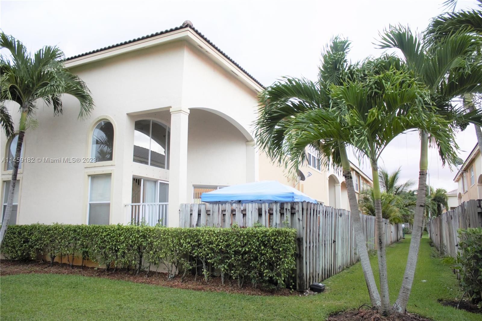 5586 Northwest 112th Path Doral, FL 33178 - Photo 30 of 30 a view of a house with a yard and potted plants