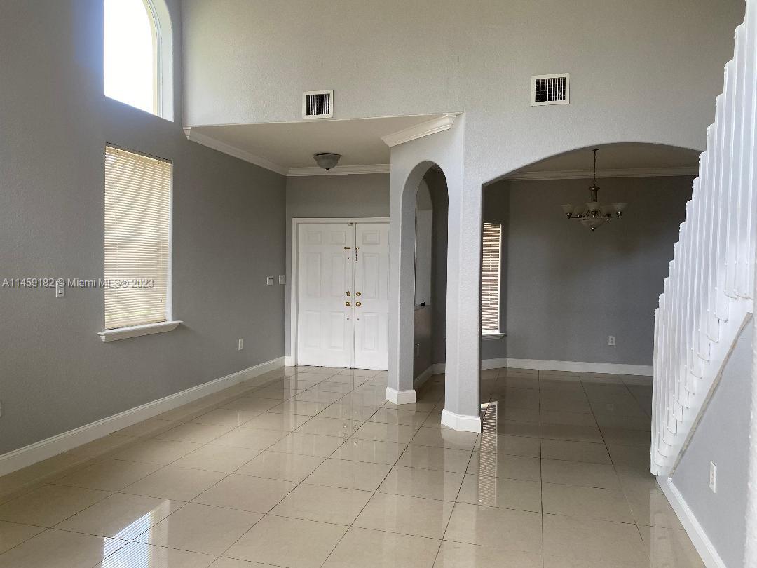 5586 Northwest 112th Path Doral, FL 33178 - Photo 5 of 30 a view of an empty room with a window