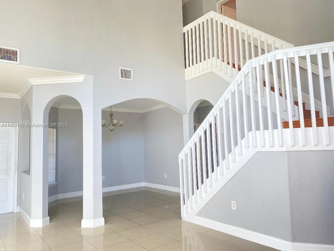 5586 Northwest 112th Path Doral, FL 33178 - Photo 6 of 30 a view of entryway with staircase and door