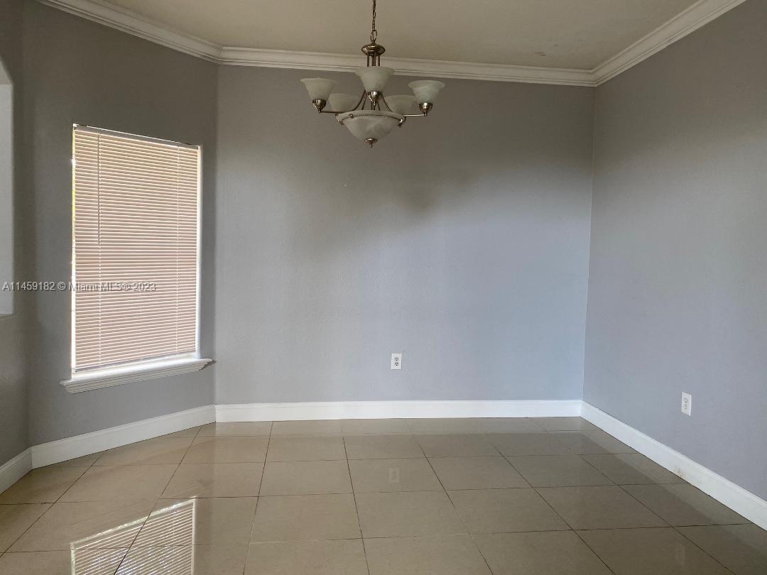 5586 Northwest 112th Path Doral, FL 33178 - Photo 7 of 30 a view of an empty room with a window