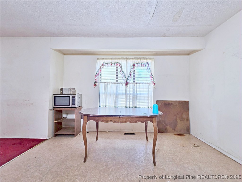 1621 Lobelia Road Vass, NC 28394 - Photo 12 of 50 a living room with furniture and a window