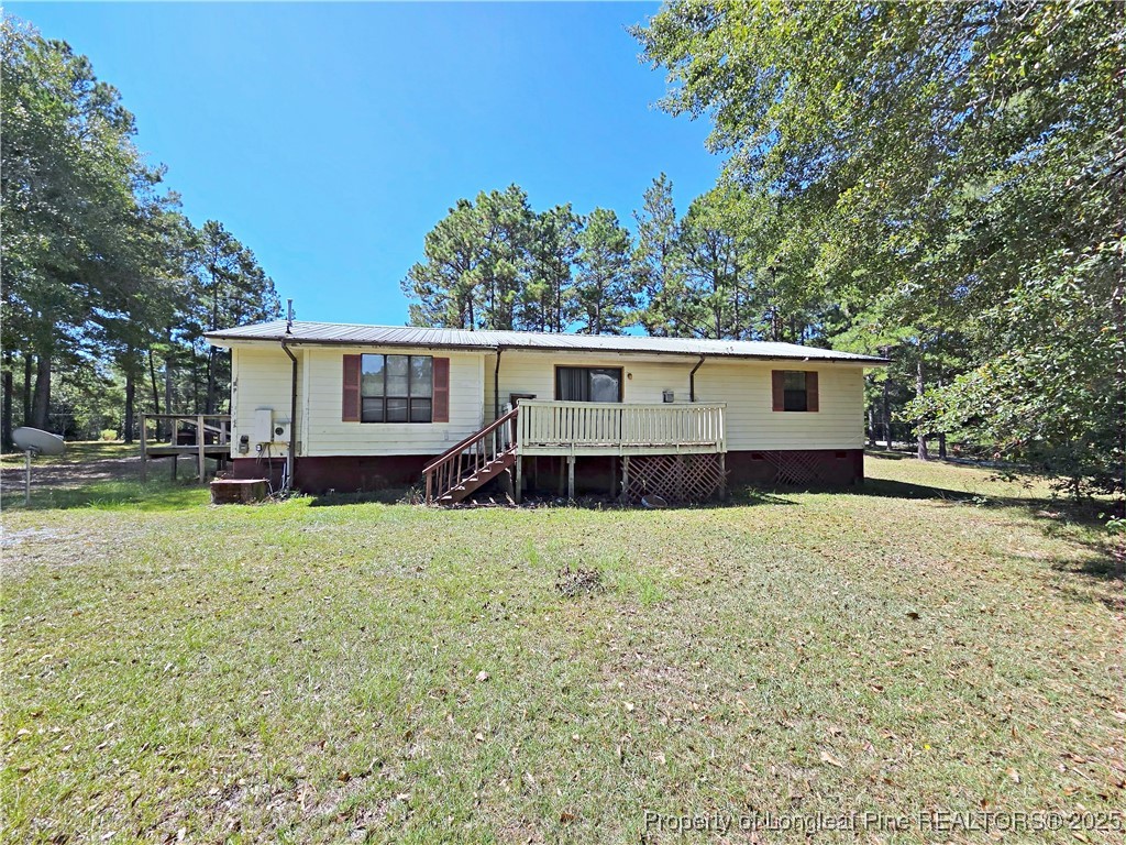 1621 Lobelia Road Vass, NC 28394 - Photo 38 of 50 front view of a house with a yard
