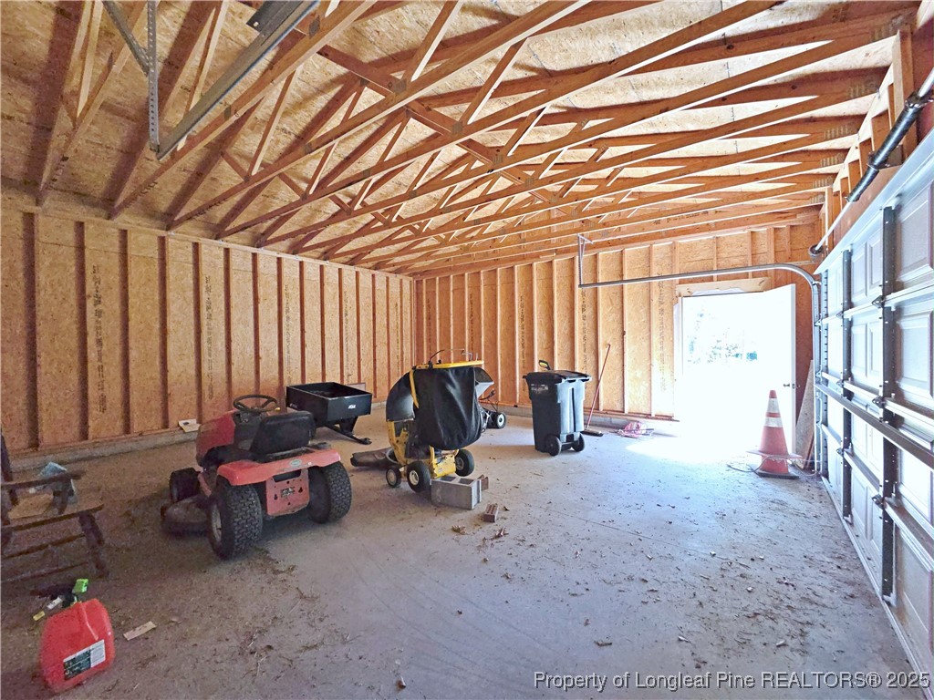 1621 Lobelia Road Vass, NC 28394 - Photo 46 of 50 a view of a room with gym equipment and next to a window