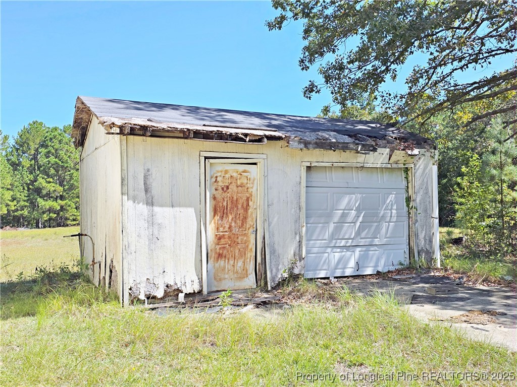 1621 Lobelia Road Vass, NC 28394 - Photo 49 of 50 a front view of a house with a yard