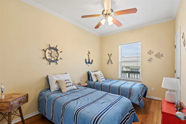 a bedroom with bed and a chandelier