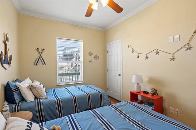 a bedroom with furniture and a window