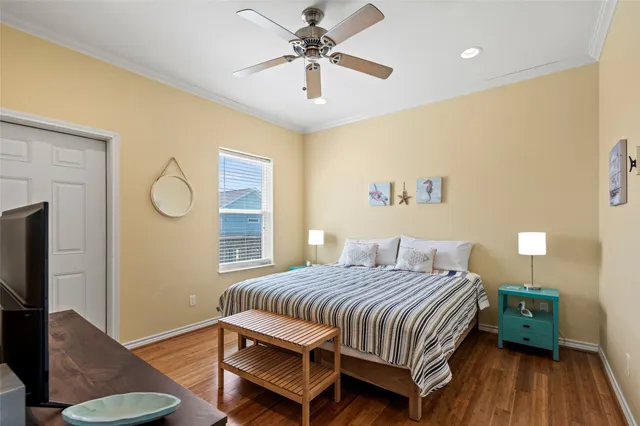 a bedroom with a bed dresser and a window