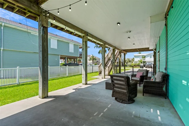 a view of living room with furniture and floor to ceiling window