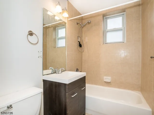 a bathroom with a sink a mirror and a bathtub