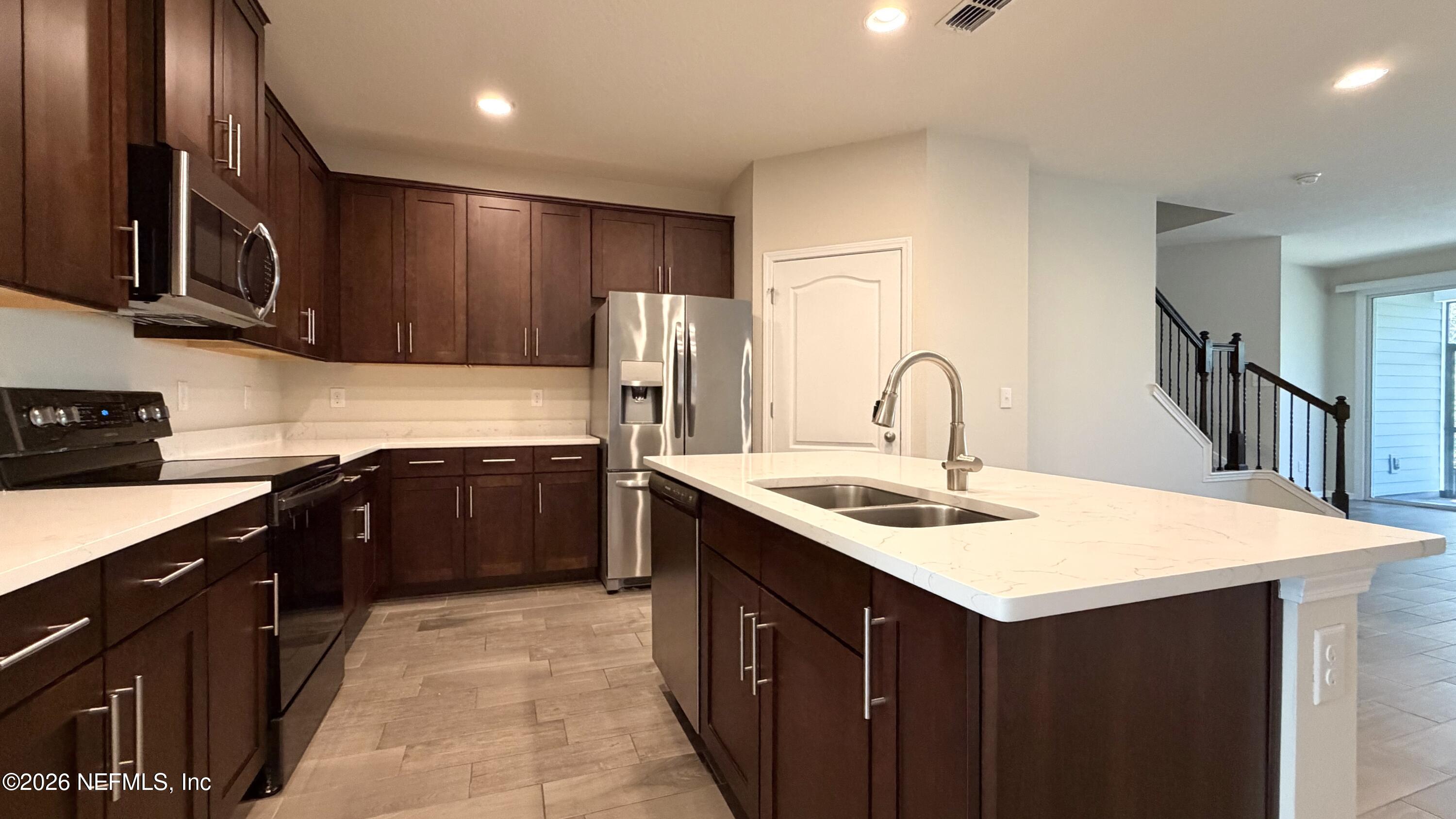47 Castro Court St. Johns, FL 32259 - Photo 3 of 19 a kitchen with a sink and cabinets