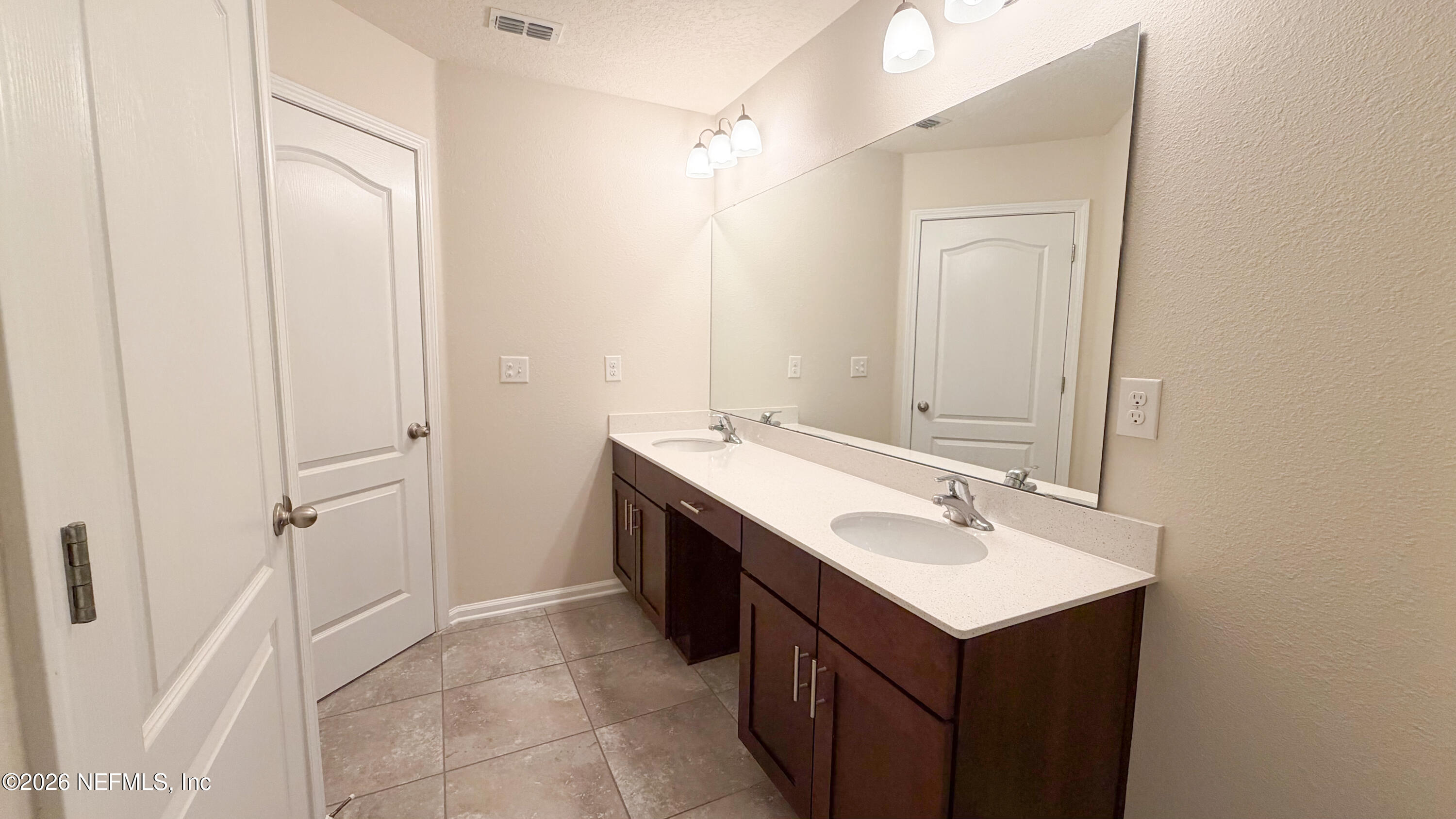 47 Castro Court St. Johns, FL 32259 - Photo 7 of 19 a bathroom with a sink and a mirror