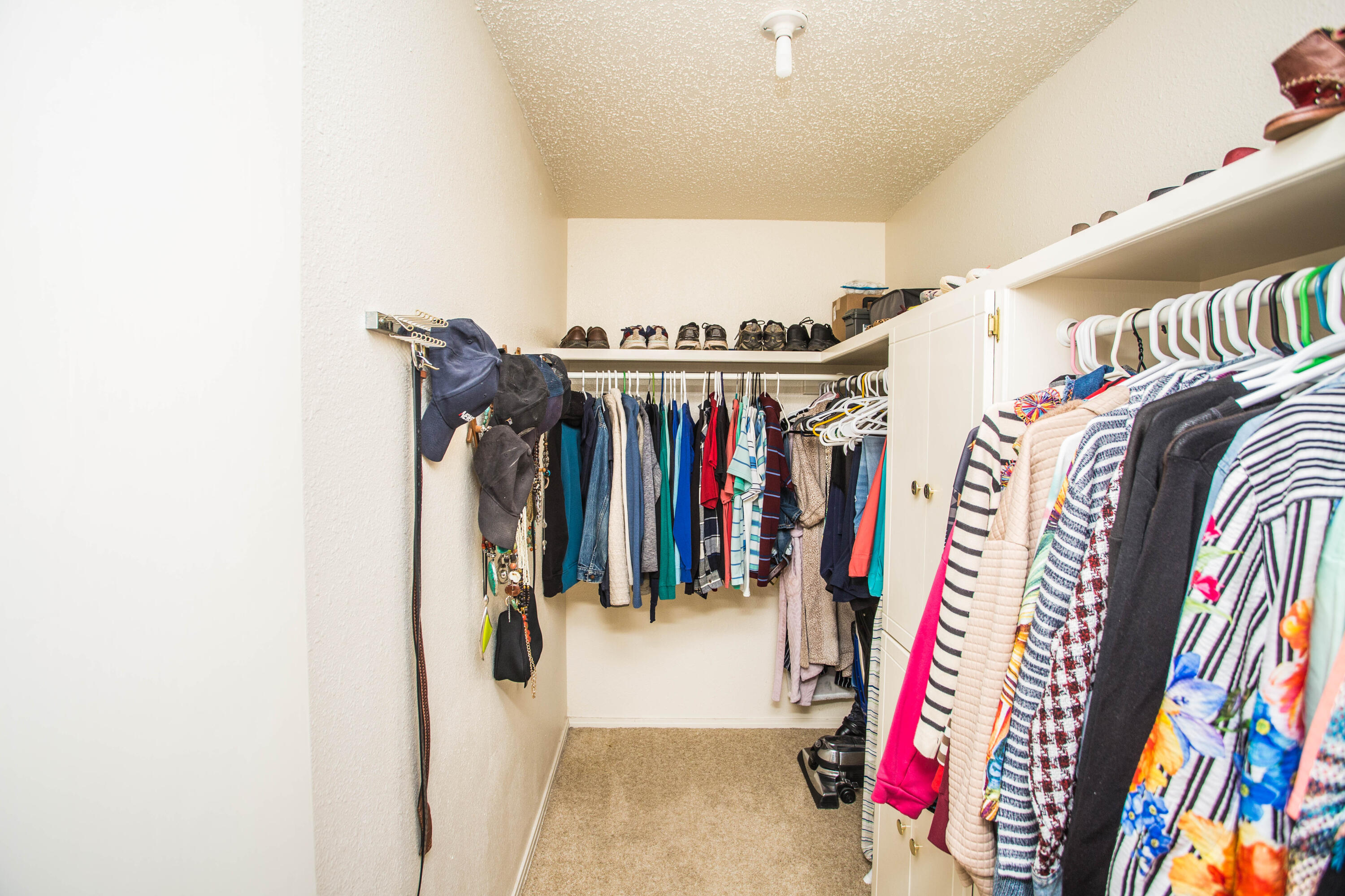 1304 Jefferson Drive Plainview, TX 79072 - Photo 23 of 50 a view of walk in closet with clothes