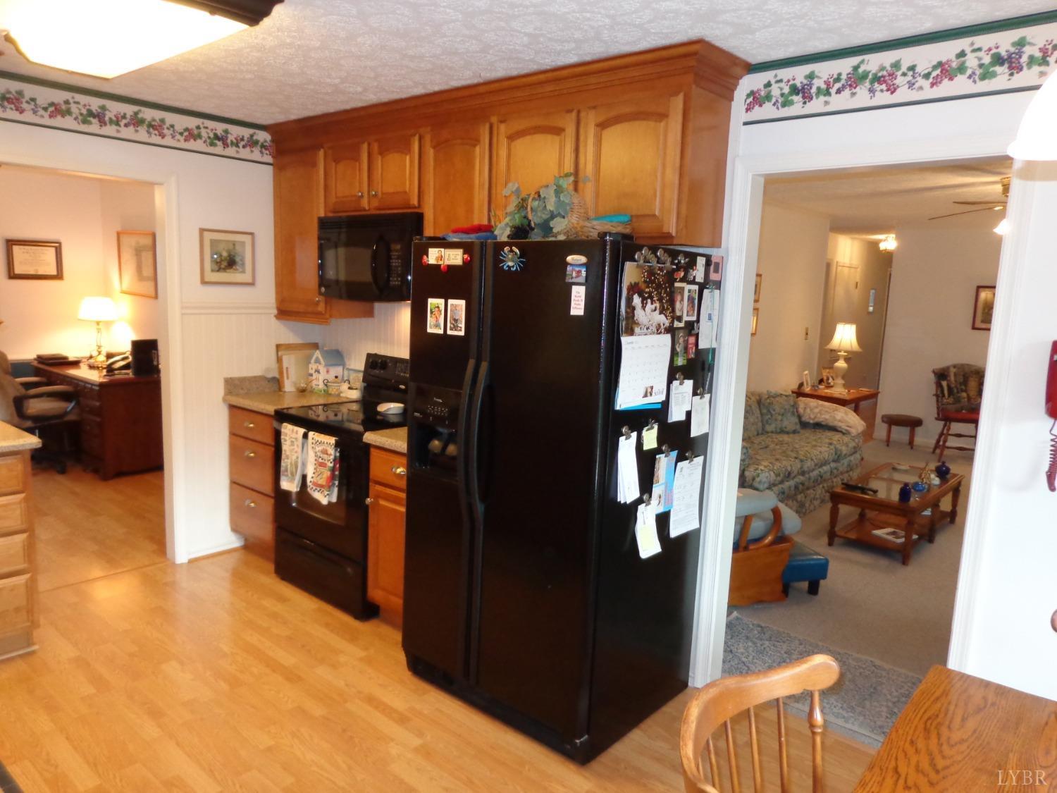 218 Otterview Road Forest, VA 24551 - Photo 27 of 63 Kitchen w/ den entry to right and formal DR entry to left