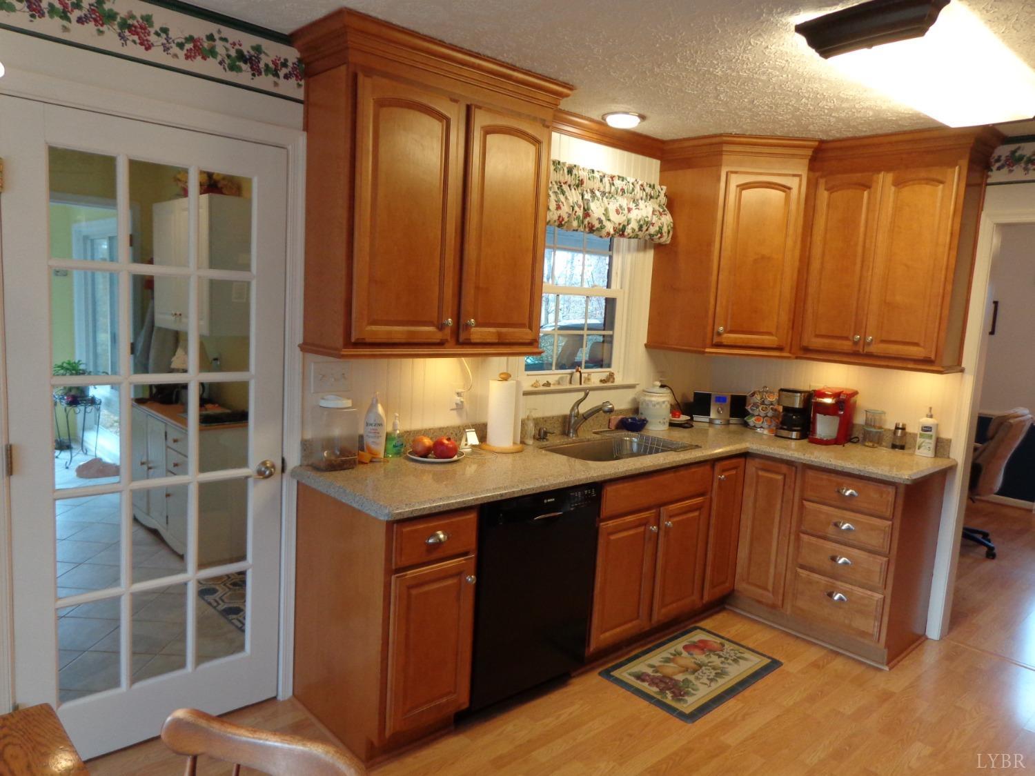 218 Otterview Road Forest, VA 24551 - Photo 28 of 63 a kitchen with stainless steel appliances granite countertop a sink and cabinets