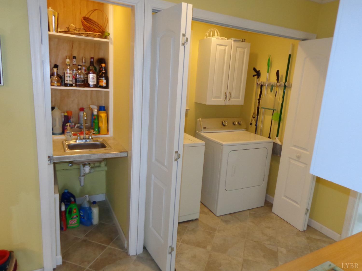 218 Otterview Road Forest, VA 24551 - Photo 32 of 63 Wet bar & laundry closet in mudroom