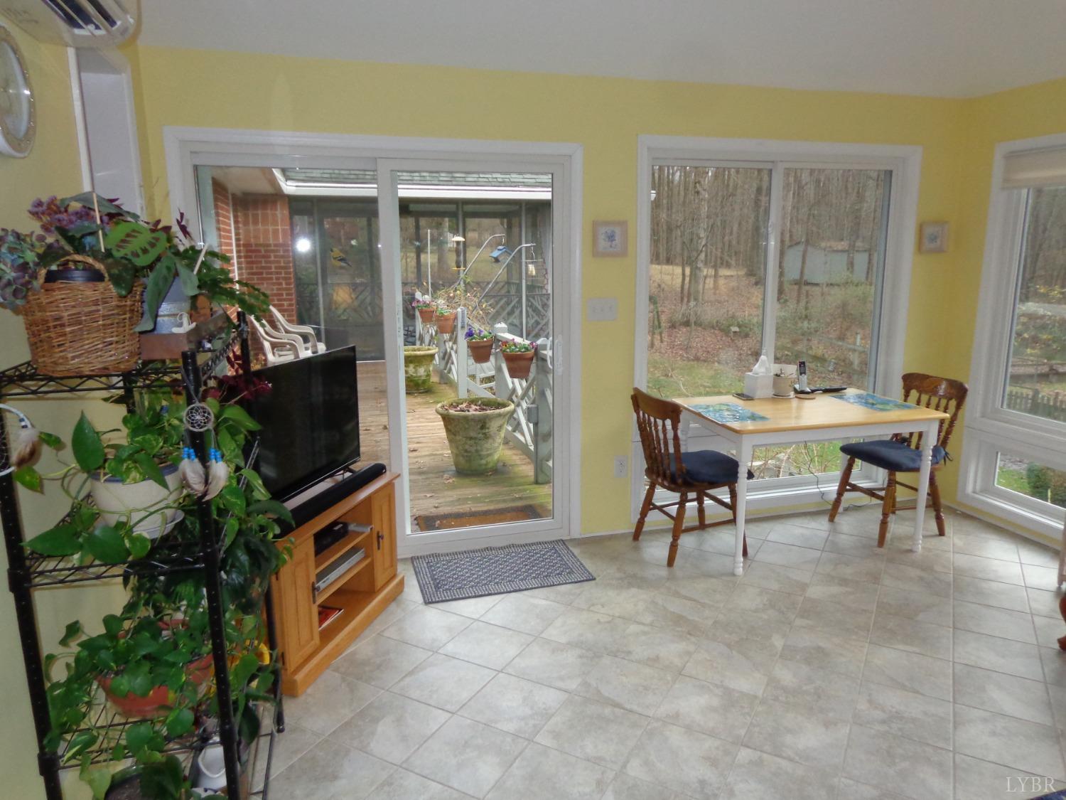 218 Otterview Road Forest, VA 24551 - Photo 35 of 63 Sliding door to deck from sunroom