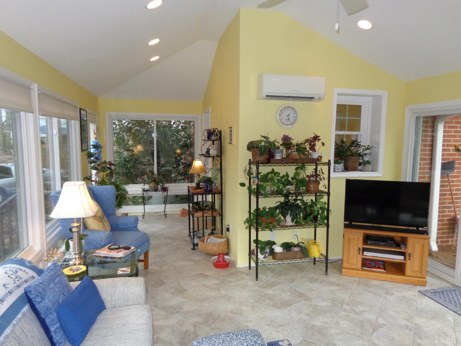 218 Otterview Road Forest, VA 24551 - Photo 36 of 63 a living room with furniture and a flat screen tv