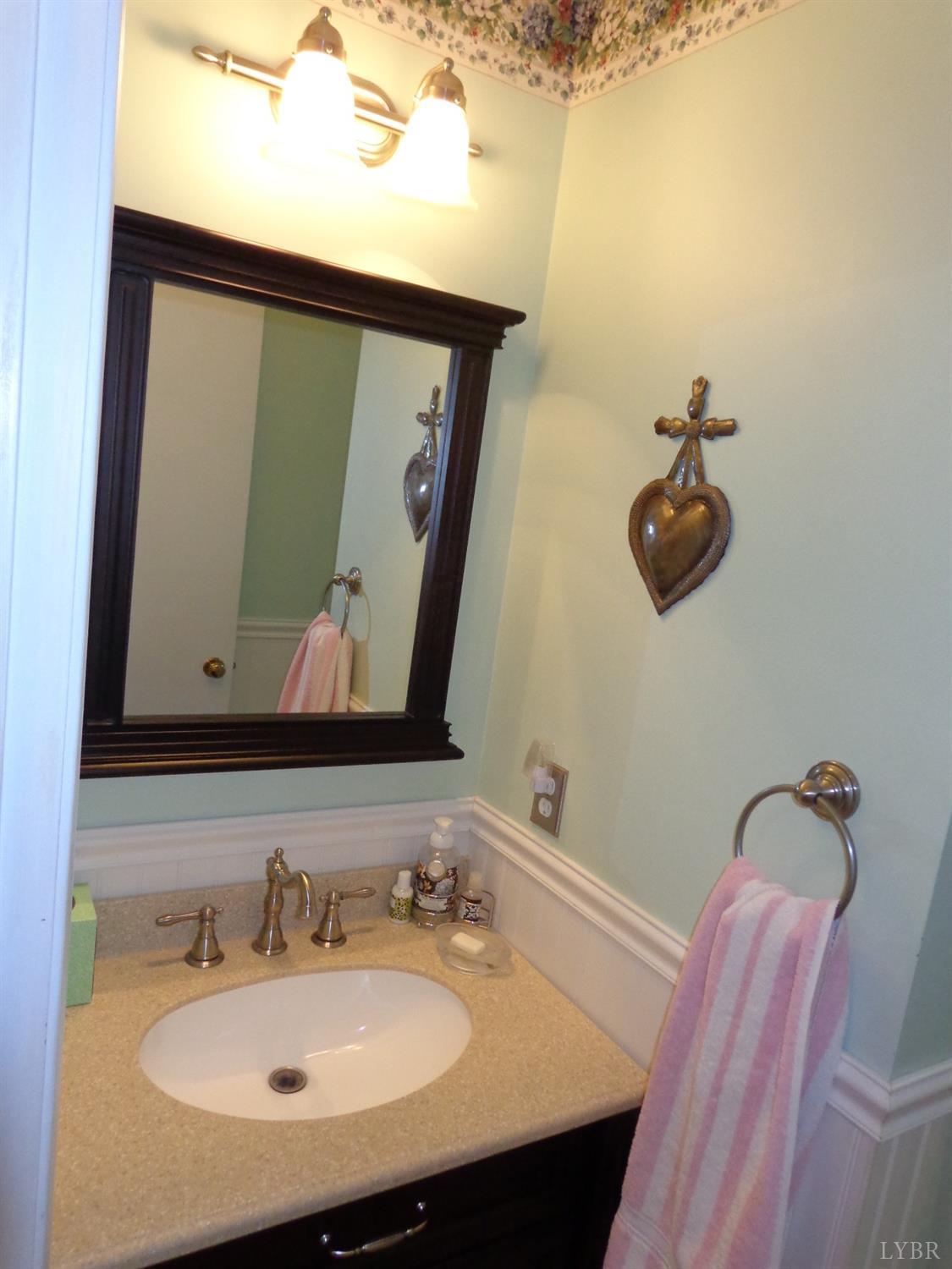 218 Otterview Road Forest, VA 24551 - Photo 44 of 63 a bathroom with a sink mirror and vanity
