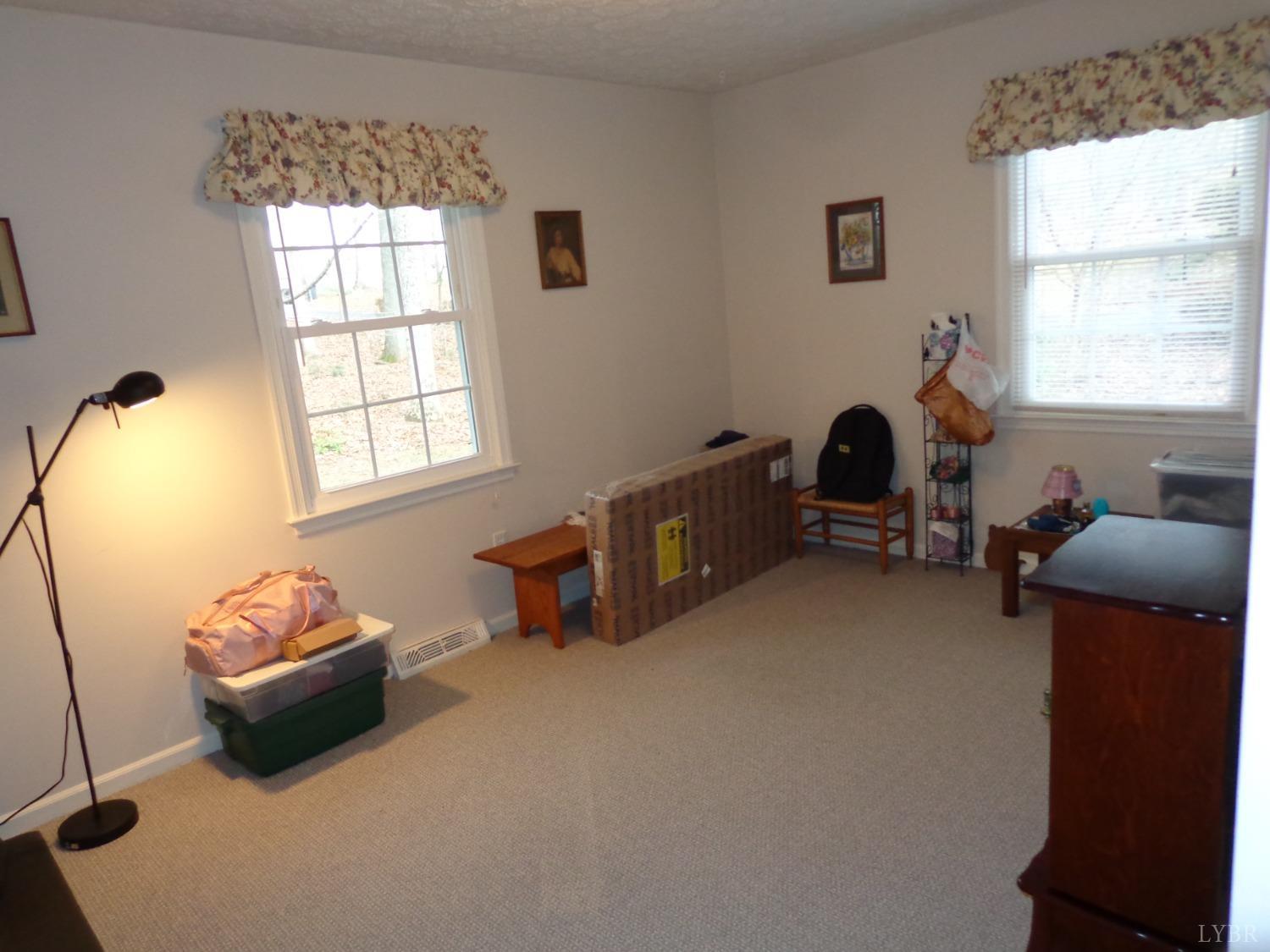 218 Otterview Road Forest, VA 24551 - Photo 47 of 63 a living room with furniture and a window