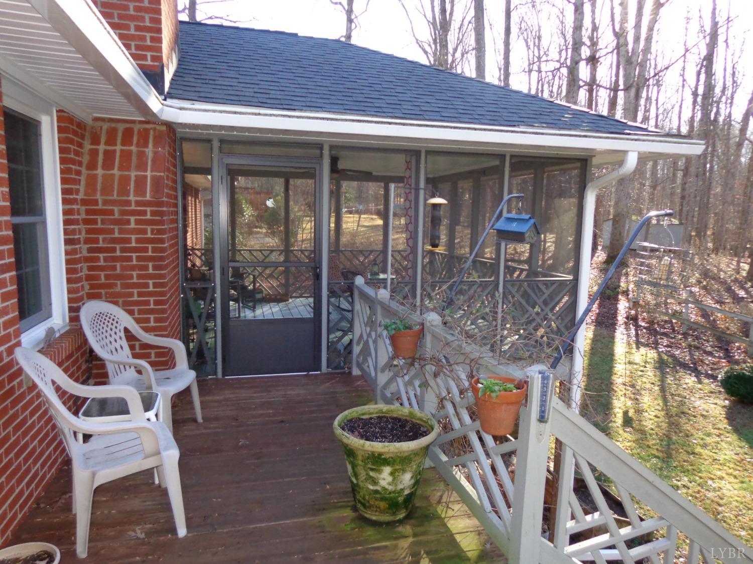 218 Otterview Road Forest, VA 24551 - Photo 7 of 63 View of screened porch from deck