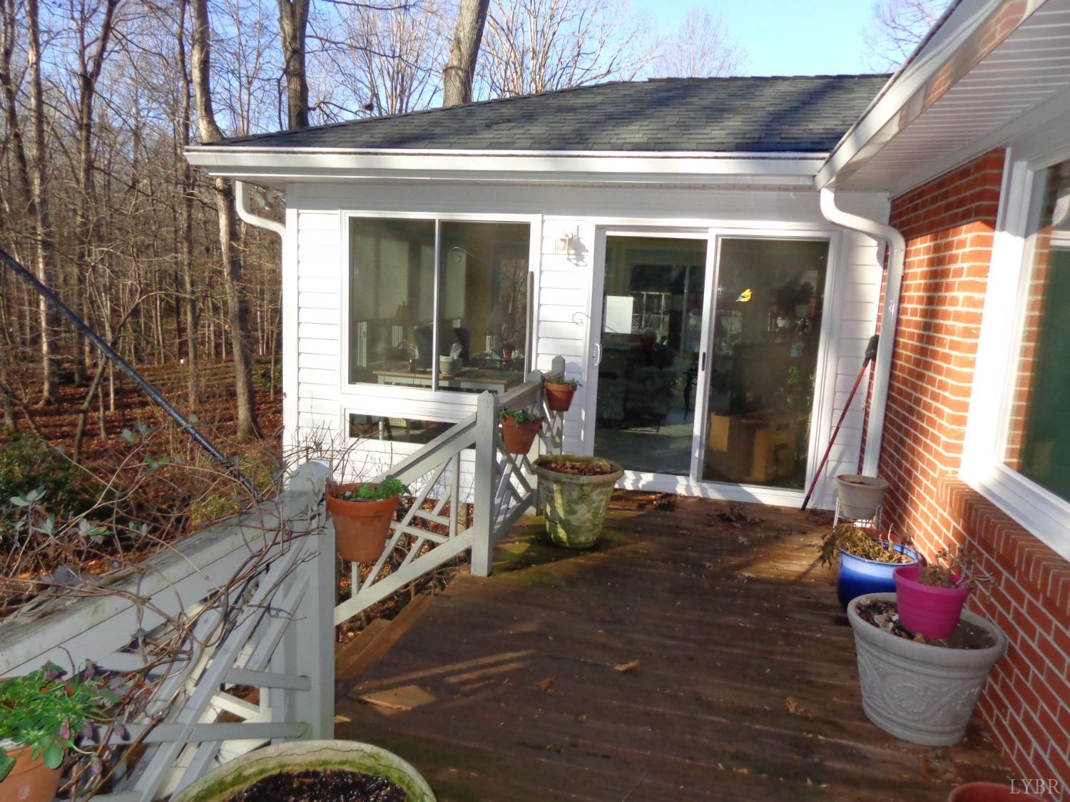 218 Otterview Road Forest, VA 24551 - Photo 8 of 63 View of sunporch from deck