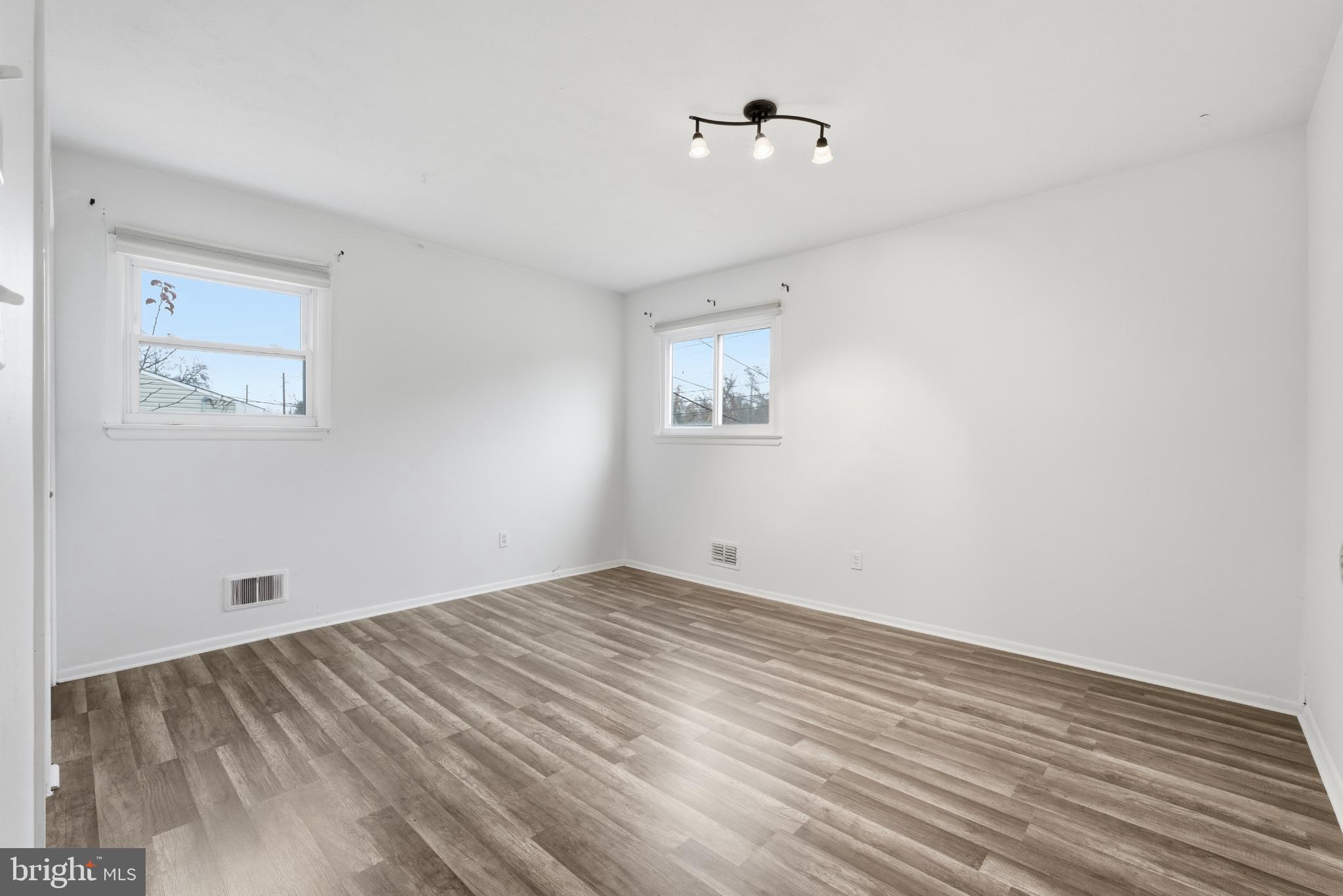 80 Mitchell Avenue Piscataway, NJ 08854 - Photo 18 of 32 a view of empty room with wooden floor