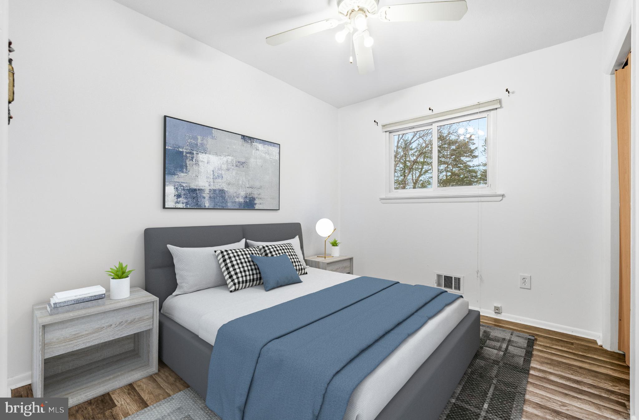 80 Mitchell Avenue Piscataway, NJ 08854 - Photo 21 of 32 a bedroom with a bed and a painting on the wall