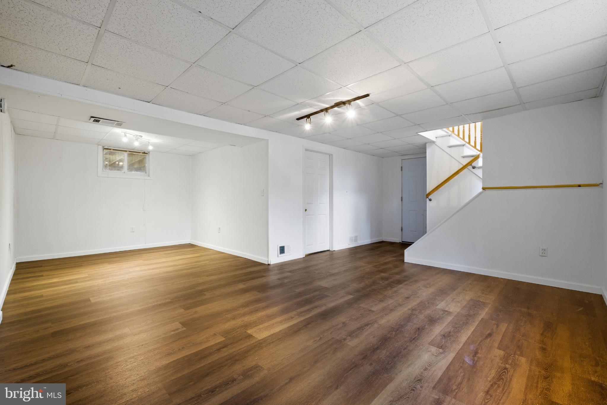 80 Mitchell Avenue Piscataway, NJ 08854 - Photo 25 of 32 a view of an empty room with wooden floor