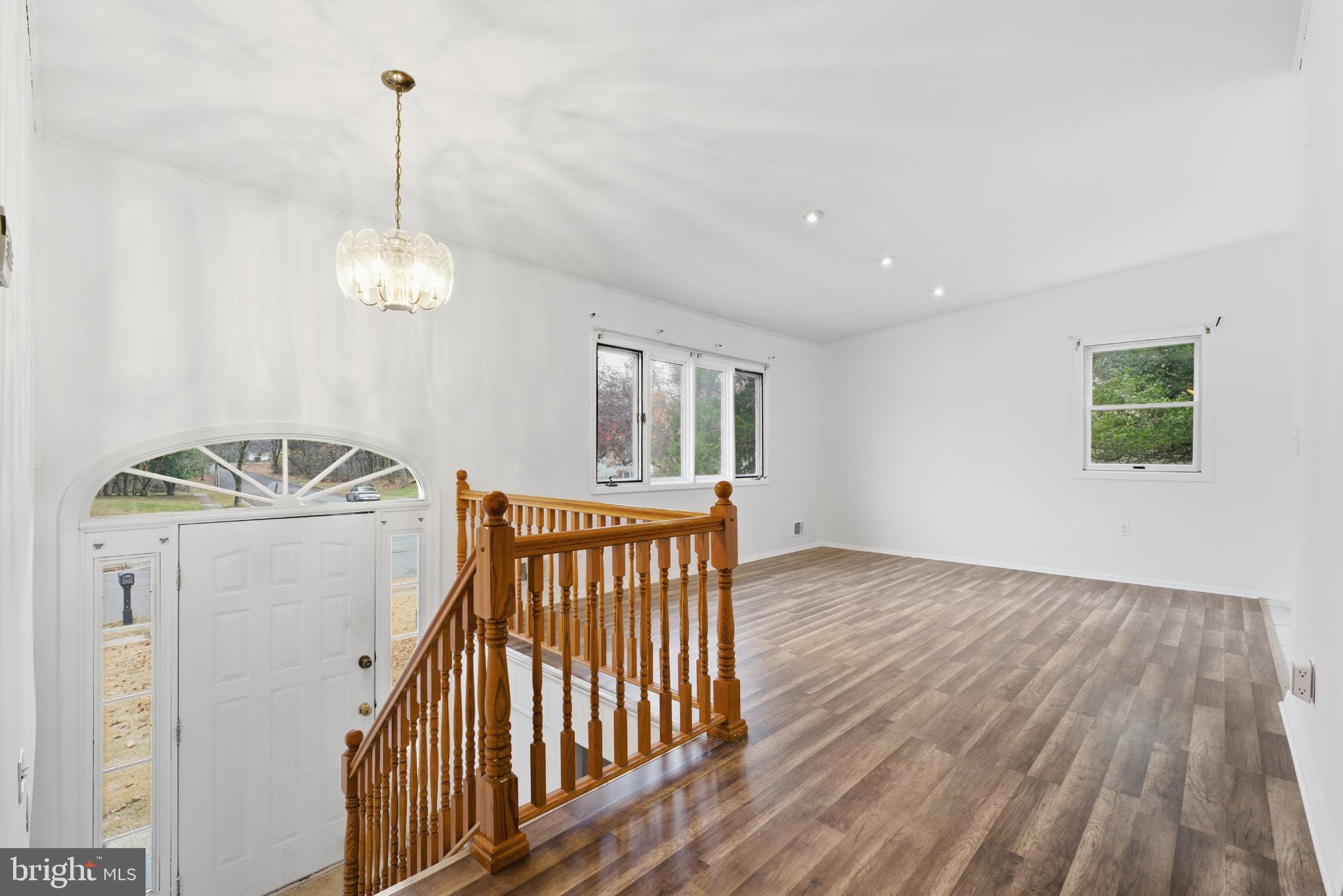 80 Mitchell Avenue Piscataway, NJ 08854 - Photo 8 of 32 a view of a livingroom with furniture wooden floor windows and entryway