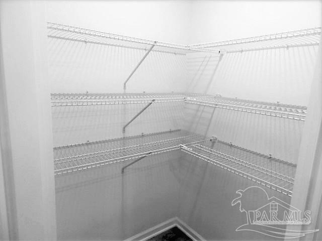 2619 Saltgrass Way Crestview, FL 32536 - Photo 6 of 30 a view of a room with racks on the wall