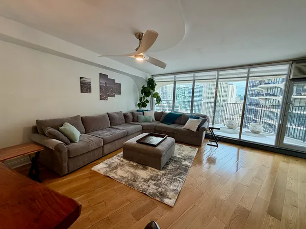 a living room with furniture and a large window