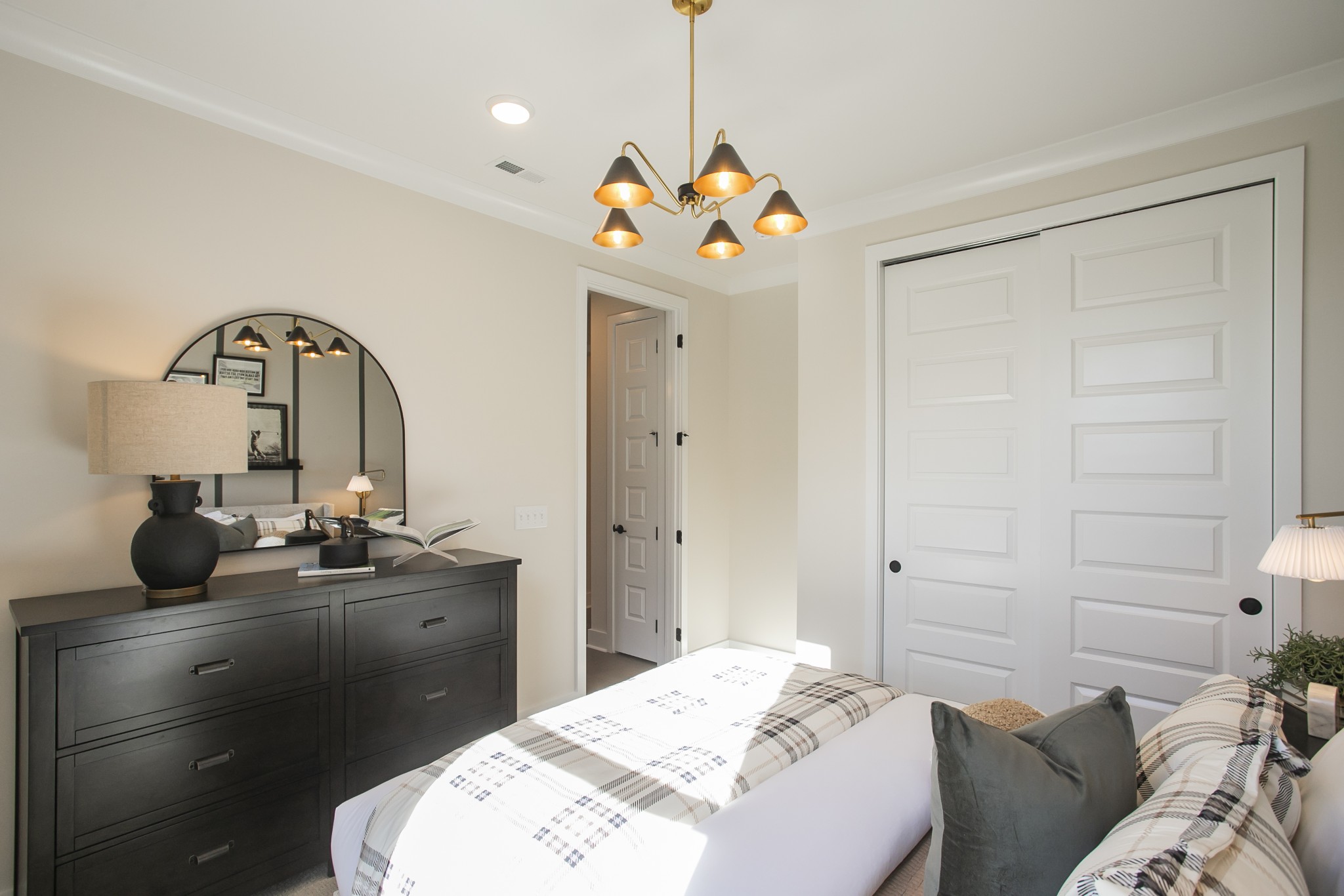 19 Pinnacles Lane Lebanon, TN 37090 - Photo 44 of 50 a bedroom with a bed and a chandelier