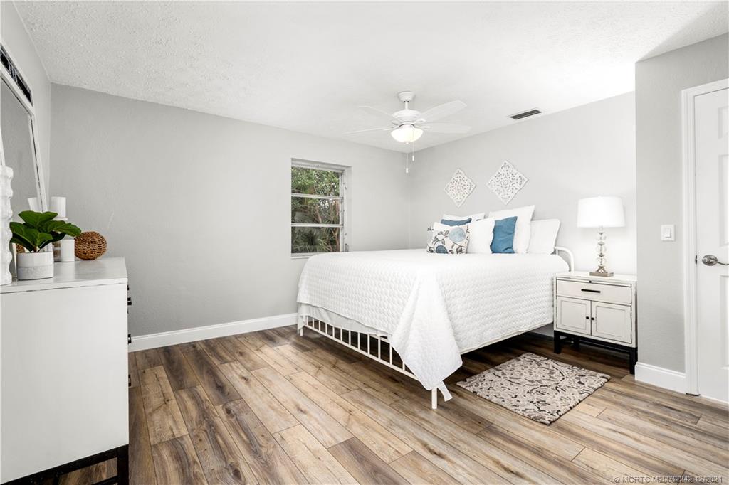 693 Northwest Spruce Ridge Drive Stuart, FL 34994 - Photo 16 of 42 Primary Bedroom