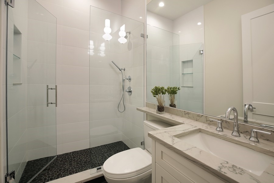 4032 Picardy Drive Northbrook, IL 60062 - Photo 14 of 38 a bathroom with a sink a toilet and shower