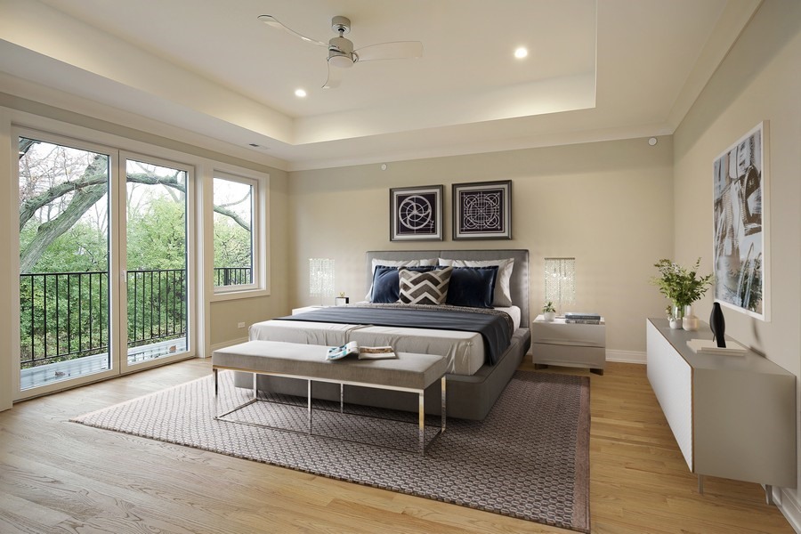 4032 Picardy Drive Northbrook, IL 60062 - Photo 15 of 38 a spacious bedroom with a bed a couch and a large window