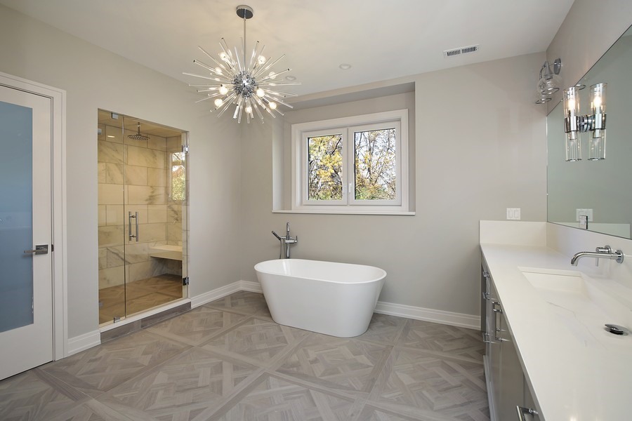 4032 Picardy Drive Northbrook, IL 60062 - Photo 17 of 38 a spacious bathroom with a sink mirror and a bathtub