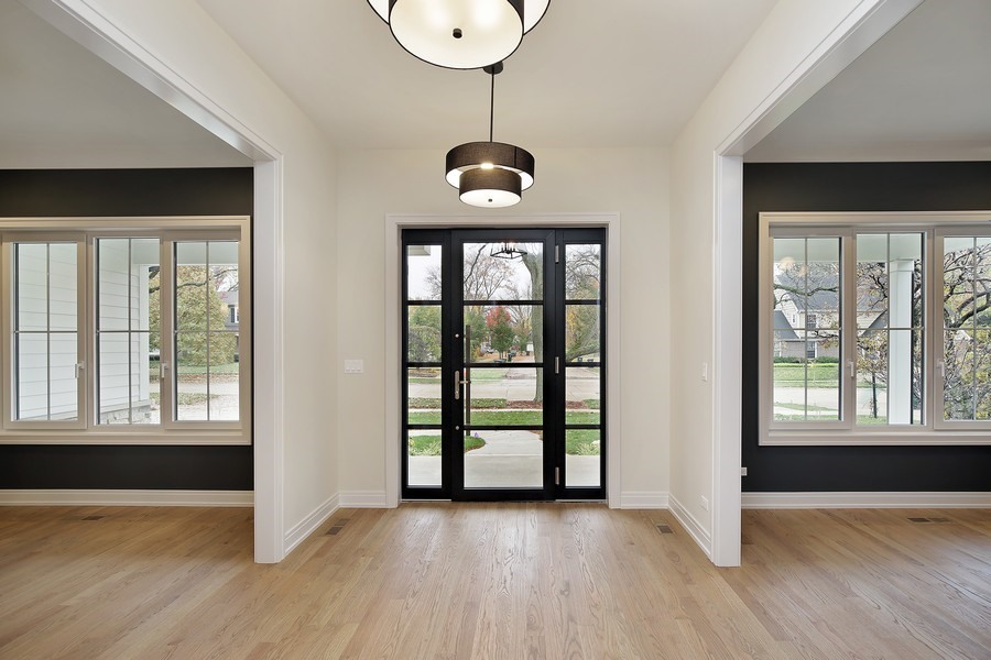4032 Picardy Drive Northbrook, IL 60062 - Photo 2 of 38 a view of an empty room with wooden floor and a window