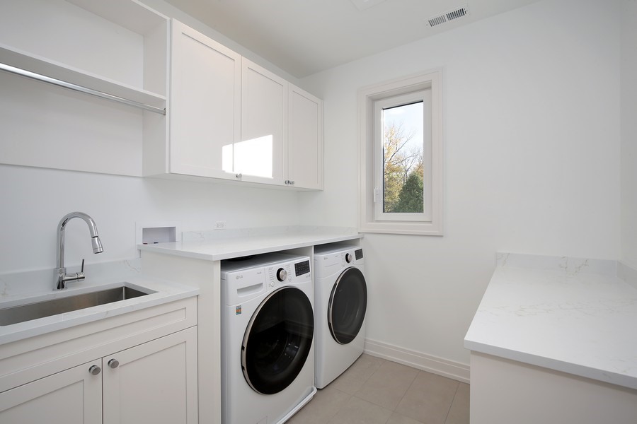 4032 Picardy Drive Northbrook, IL 60062 - Photo 24 of 38 a utility room with sink dryer and washer