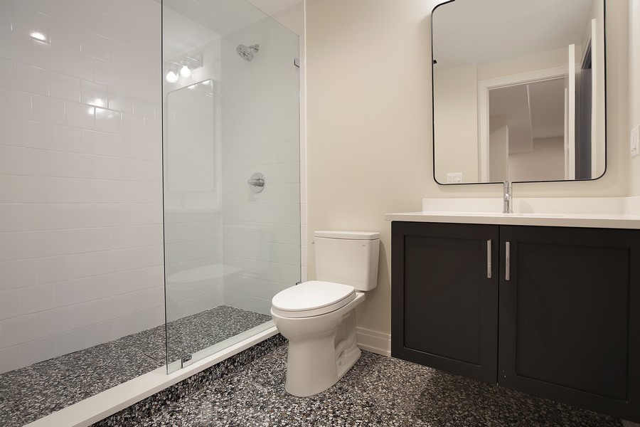 4032 Picardy Drive Northbrook, IL 60062 - Photo 31 of 38 a bathroom with a toilet sink and a mirror