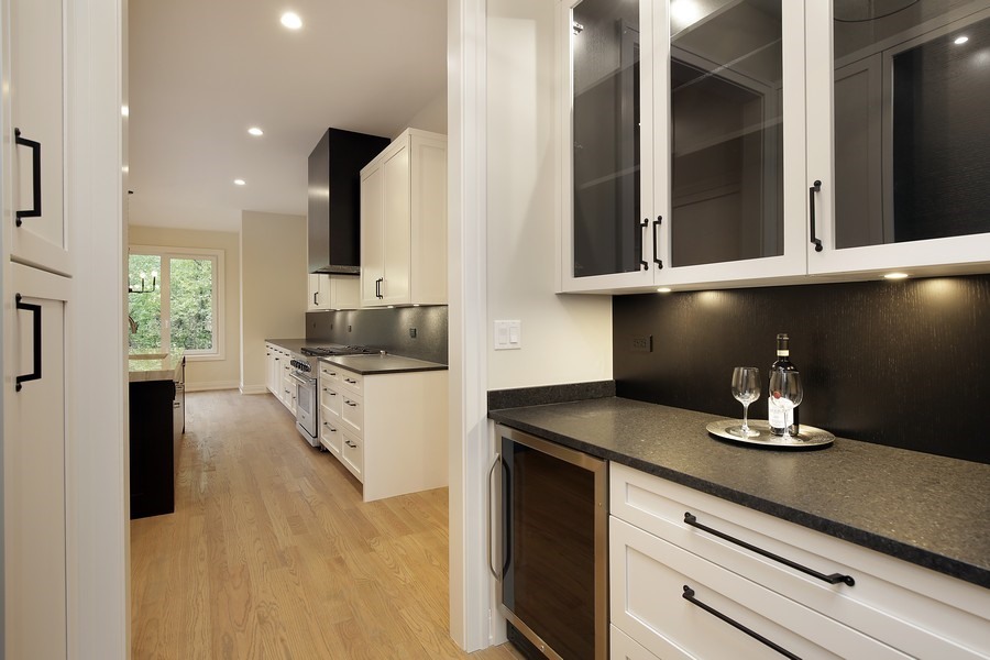 4032 Picardy Drive Northbrook, IL 60062 - Photo 10 of 38 a kitchen with a refrigerator and cabinets