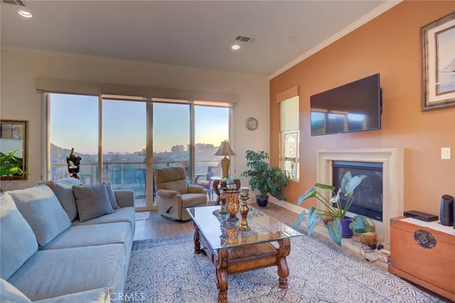 a kitchen with granite countertop a table chairs stove a sink and dishwasher